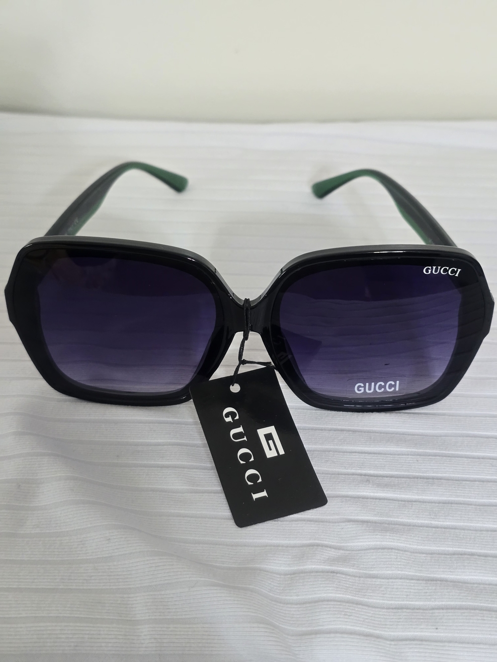 Gucci Black Frame Sunglasses with Purple Gradient Lenses
